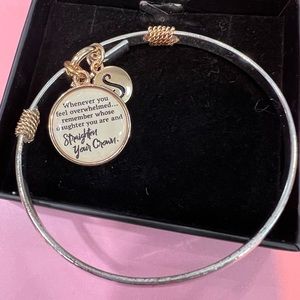 Lovely sliver & gold, dangle bracelet w/“S” initial & daughter saying.